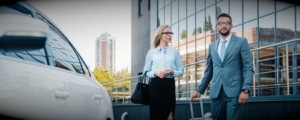 two business travelers on their way to a rental car