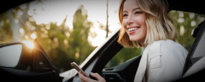 a women stepping out of her company car